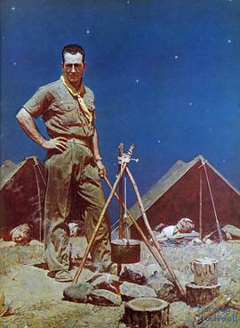 Scoutmaster in front of tents