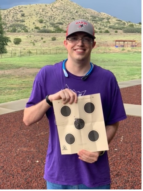 Philmont Zia participant with targets from the shooting range